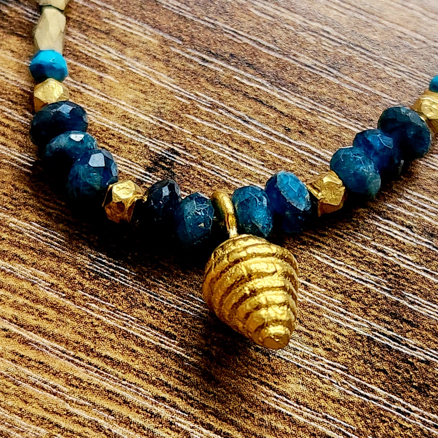 Faceted Apatite Gold Overlay Shell Bracelet